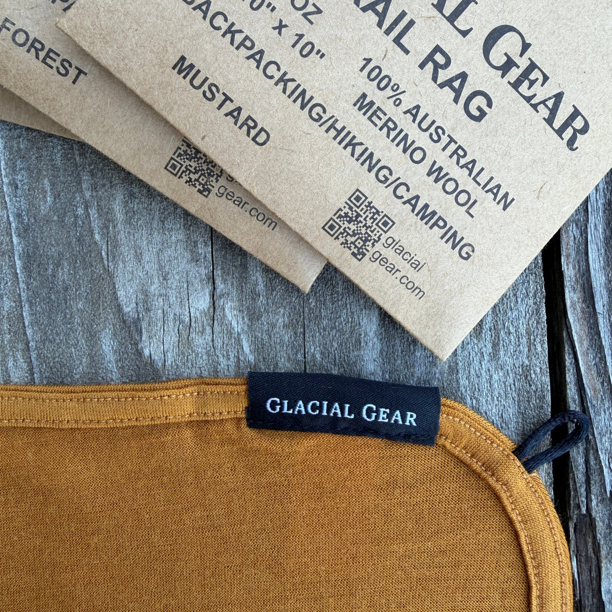 Glacial Gear label on a brown fabric item with packaging in the background.