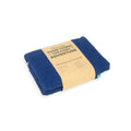Blue towel with cardboard packaging on a white background