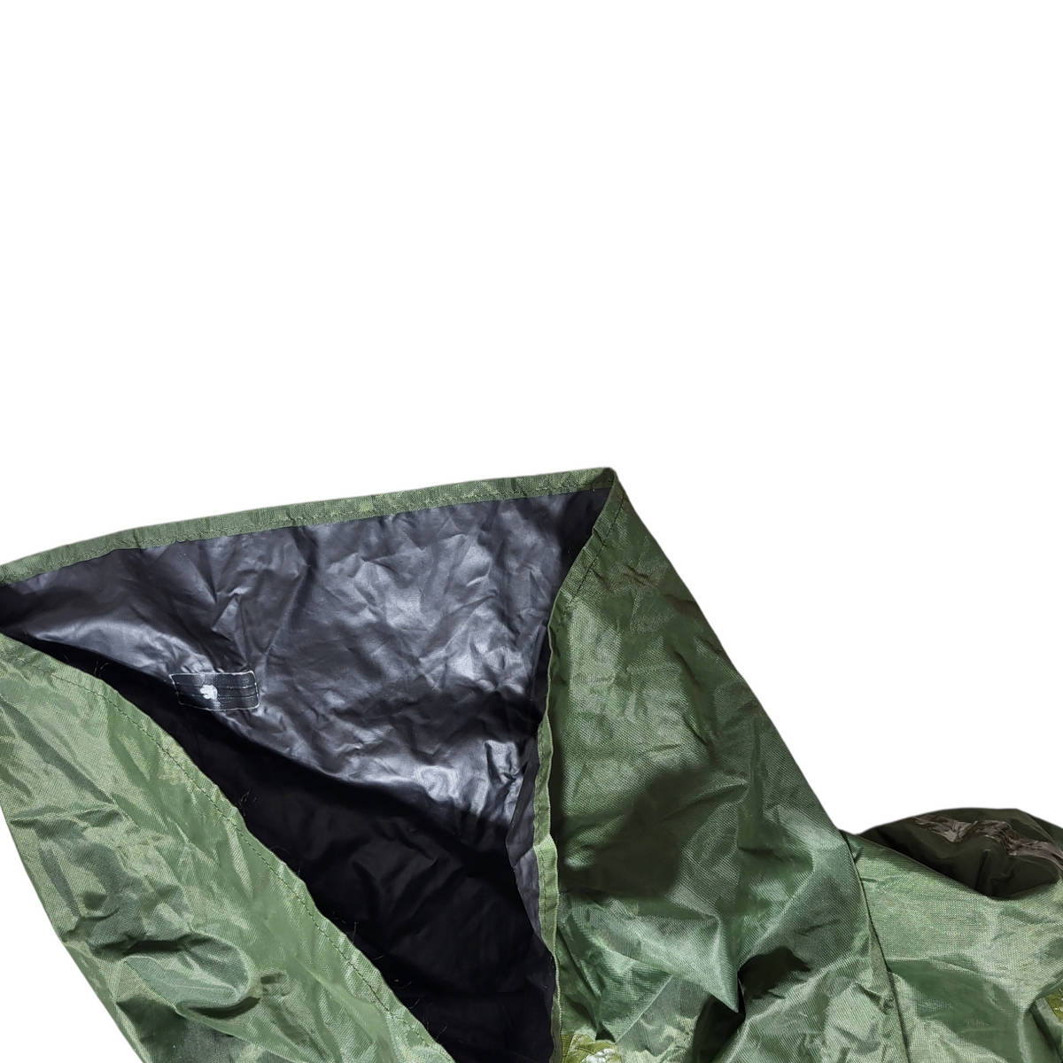 Green and black tarp on a white background
