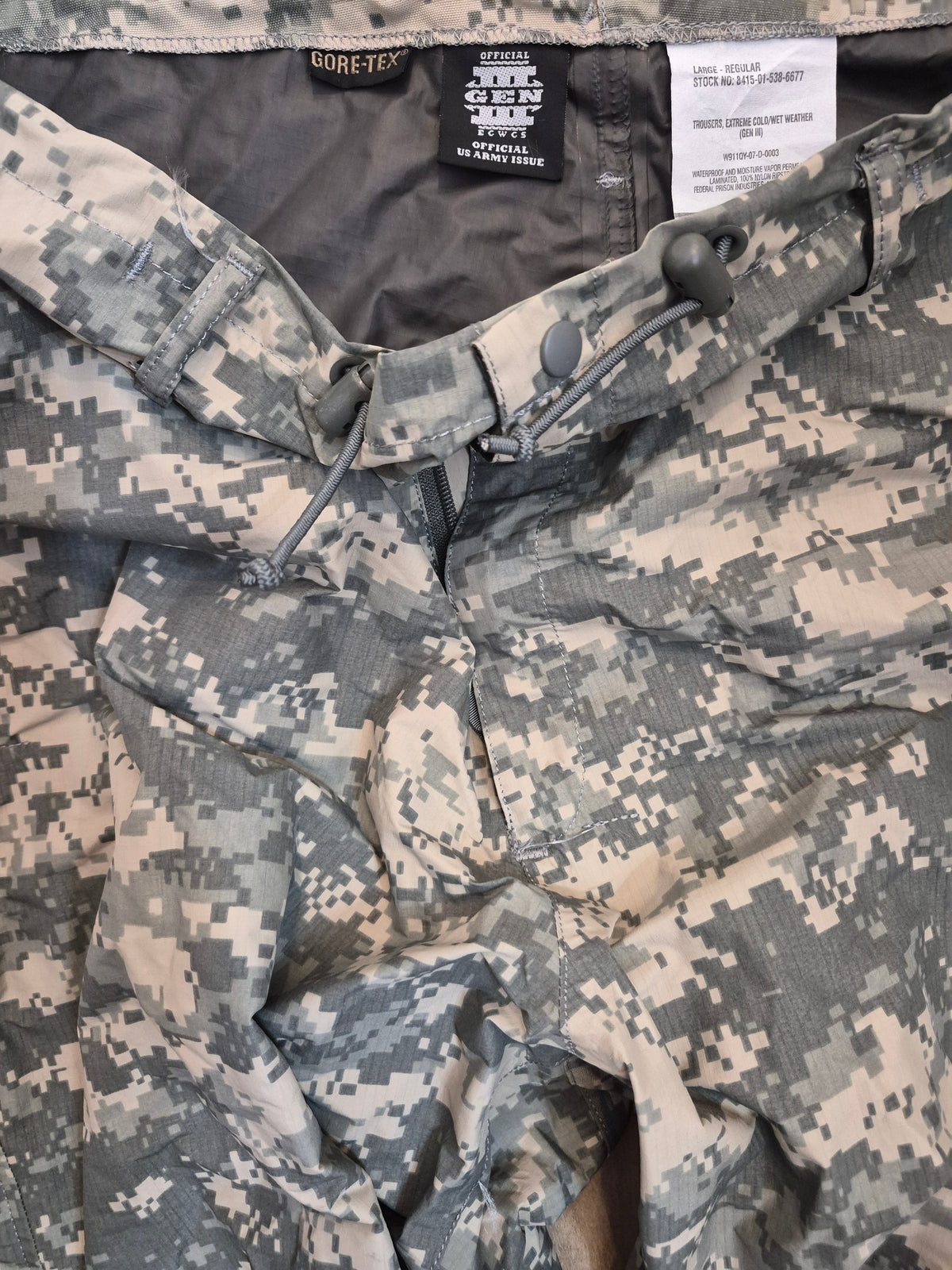 Close-up of camouflage military uniform with GORE-TEX label