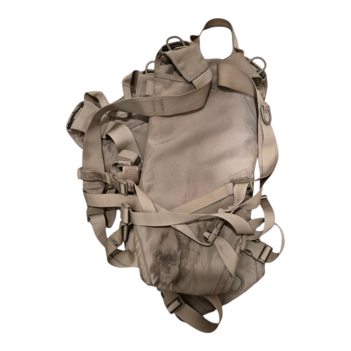 Tan backpack with multiple straps on a white background