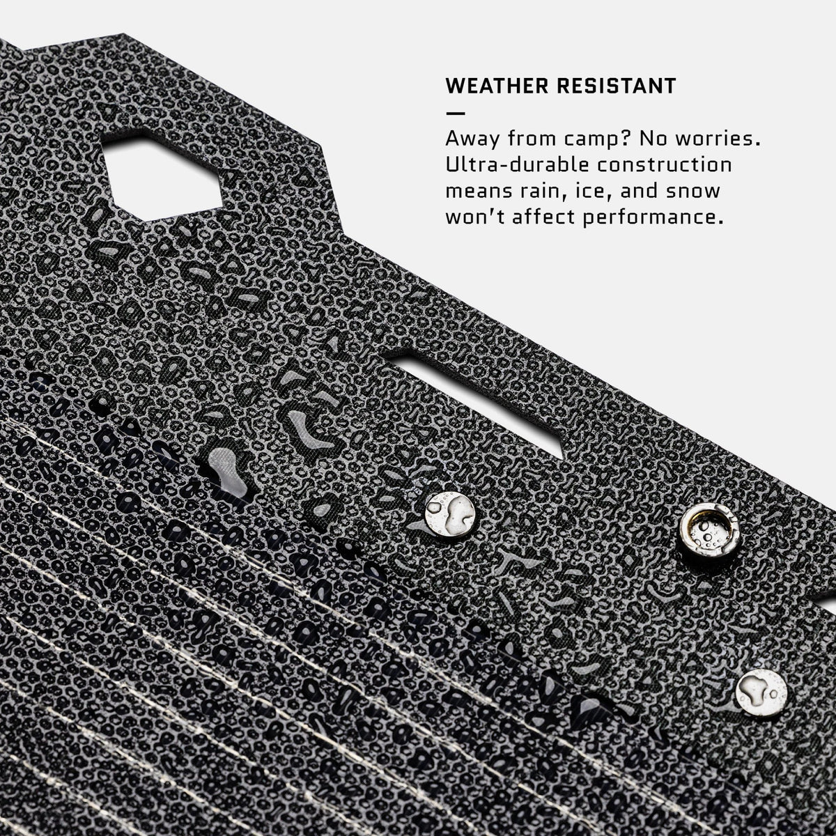 Text on a textured surface highlighting weather resistance of a product.